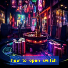 how to open switch oled game card slot