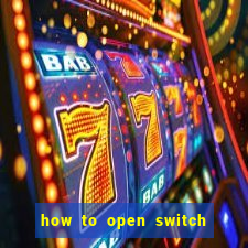 how to open switch oled game card slot